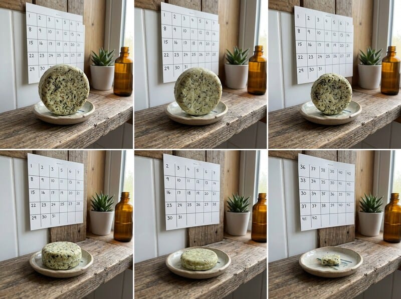 Solid shampoo bar stored dry on a draining soap dish